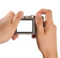 Compact digital photo camera held in hands Royalty Free Stock Photo