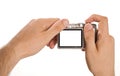 Compact digital photo camera held in hands Royalty Free Stock Photo
