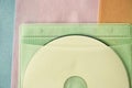 Compact disc in color bag Royalty Free Stock Photo