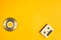 Compact disc and digital video cassette on yellow background. copy space Royalty Free Stock Photo