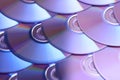 Compact discs background. Several cd dvd blu-ray discs. Optical recordable or rewritable digital data storage. Royalty Free Stock Photo