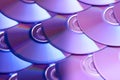 Compact discs background. Several cd dvd blu-ray discs. Optical recordable or rewritable digital data storage. Royalty Free Stock Photo