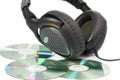 Compact Discs (CDs) with headphones Royalty Free Stock Photo