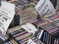 Close up of a stack of various compact discs, cds for sale on a stall Royalty Free Stock Photo