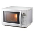 A compact electric microwave oven with digital panel, isolated on a pure white background. Perfect for appliance catalogs, kitchen Royalty Free Stock Photo