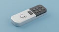 Compact electronic remote control with a minimalist design on a light blue background Royalty Free Stock Photo
