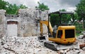 Compact Excavator on Small Building Site Royalty Free Stock Photo