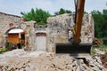 Compact Excavator on Small Building Site Royalty Free Stock Photo