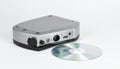 Compact External Device and Mini Disc on White Background Royalty Free Stock Photo