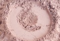 Compact face powder (bronzer, brusher) texture macro. Make-up background. Selective focus, copy space Royalty Free Stock Photo