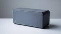 A compact, gray speaker designed for audio playback and smart home integration Royalty Free Stock Photo