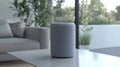 A compact, gray speaker designed for audio playback and smart home integration Royalty Free Stock Photo
