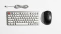 Compact keyboard with round white keys and a red escape key paired Royalty Free Stock Photo