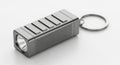 Compact keychain flashlight with durable metal casing for everyday carry needs Royalty Free Stock Photo
