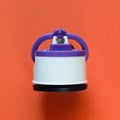 Compact kitchen knife sharpener on orange background Royalty Free Stock Photo