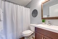 Compact light bathroom with soft gray walls