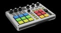 Compact MIDI Controller with Colorful Pads and Knobs on Black Background Royalty Free Stock Photo