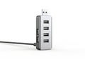 Compact multi-port usb charger adapter with a sleek metallic design and a single usb cable Royalty Free Stock Photo
