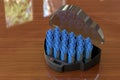 Compact Multi-Size Hot Rollers on the wooden table. 3D rendering