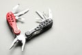Compact portable multitool on light grey background, closeup. Space for text Royalty Free Stock Photo