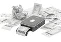 Compact portable printer printing receipts amidst scattered paper clutter Royalty Free Stock Photo