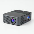 Compact rectangular projector with a dual-lens setup. Features include a sleek black Royalty Free Stock Photo