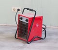 Compact red heater, drying the floor