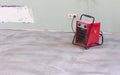 Compact red heater, drying the floor