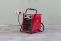 Compact red heater, drying the floor