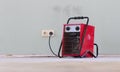 Compact red heater, drying the floor