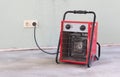 Compact red heater, drying the floor