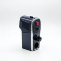 Compact, retro-style handheld video camera with a dark blue and chrome finish. Royalty Free Stock Photo