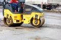 The compact road roller works by compacting the base of the roadway