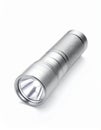 Compact Silver Metal Flashlight on White Background Royalty Free Stock Photo