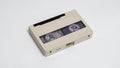 Compact size U-matic videocassette on a white background, front view