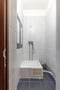 Small Tiled Shower Room with Minimal Fixtures Royalty Free Stock Photo