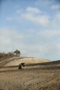 Compact track loader working under the blue sky on Sucre, Ecuador Royalty Free Stock Photo