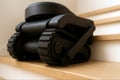 Compact tracked robot on wooden stair, generative ai Royalty Free Stock Photo