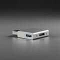 Compact USB hub with a sleek metallic design, featuring multiple USB ports on the Royalty Free Stock Photo