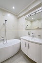 Compact white cozy bathroom with bathub Royalty Free Stock Photo