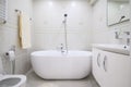 Compact white cozy bathroom with bathub Royalty Free Stock Photo