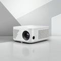 A compact, white digital projector placed on a smooth, reflective surface. It features a Royalty Free Stock Photo