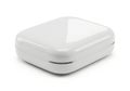 A small white rectangular electronic device with rounded edges isolated on white background Royalty Free Stock Photo