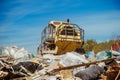 Compactor at a landfill processing municipal waste Royalty Free Stock Photo