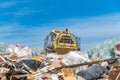 Compactor processes waste at a landfill Royalty Free Stock Photo