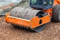 Compactor with vibratory padfoot drum working