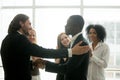 Company boss promoting african american employee with handshake Royalty Free Stock Photo
