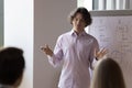 Company ceo gives flipchart presentation with sales data Royalty Free Stock Photo