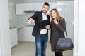 Company employee showing apartment to buyer