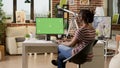 Company employee using greenscreen on computer and doing remote work Royalty Free Stock Photo